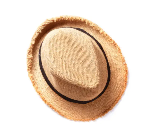 Beach sun hat isolated on white background. Top view flat lay