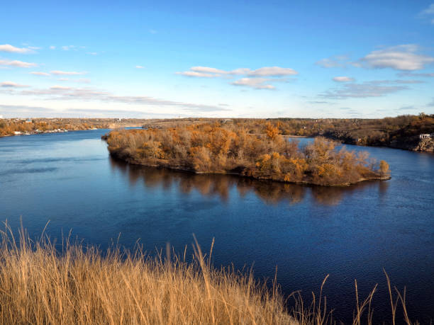 istock Island in the autumn forest with reflection 1285077438