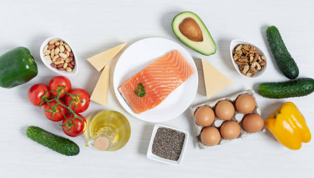istock Ingredients for ketogenic diet top view on white wooden table. 1285079081