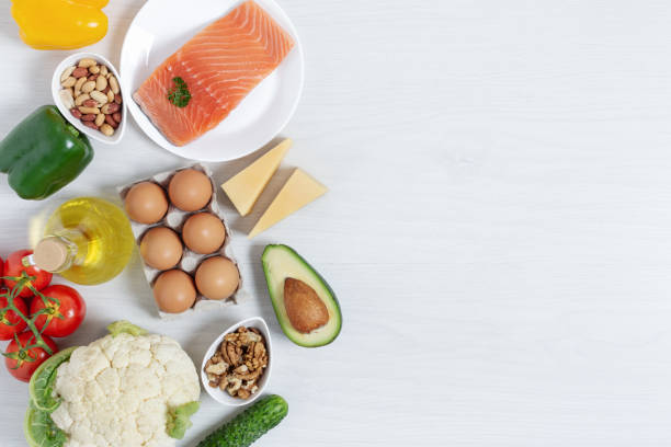 istock Ingredients for ketogenic diet top view on white wooden table. 1285079082