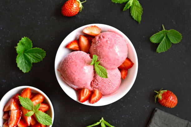 Strawberry ice cream in bowl stock photo