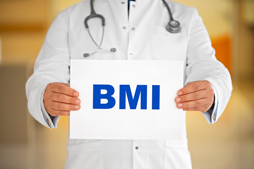 Doctor holding a paper written BMI, Body Mass Index
