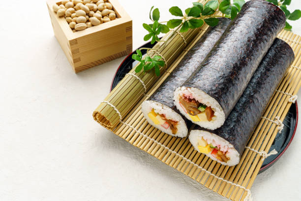 istock Eho-maki are thick sushi rolls which is believed to bring good fortune if eaten while facing the year's 