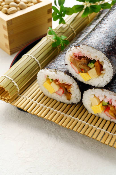 istock Eho-maki are thick sushi rolls which is believed to bring good fortune if eaten while facing the year's 