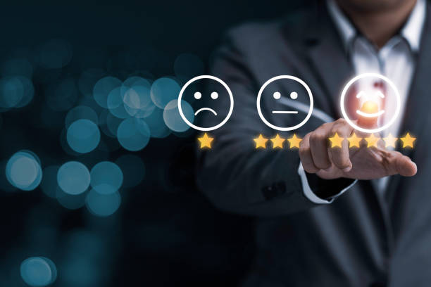 istock Businessman touching smile face icon for customer online evaluation result for five star. Customer satisfaction for product and service concept. 1285084758