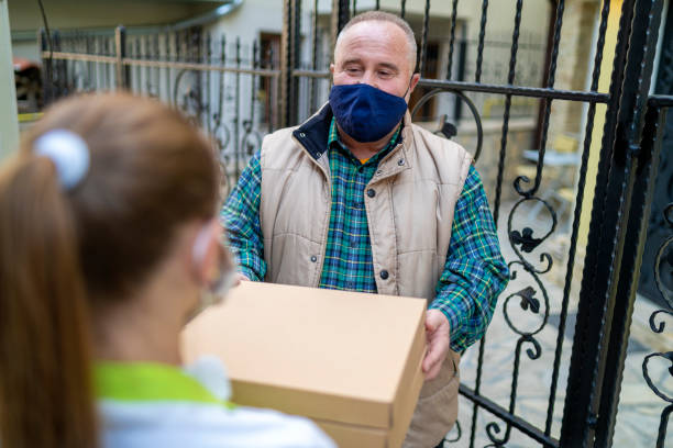 istock Home delivery of a pizza during a pandemic 1285085380