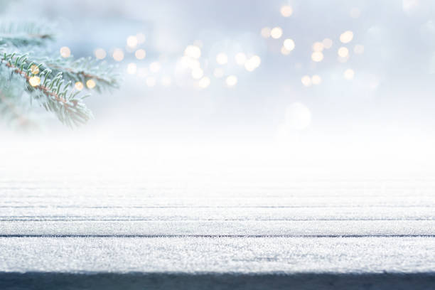 istock Frosty boards with fir branch and bokeh 1285086094