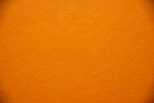 istock Orange real paper texture. The lines are angled. The pattern is like squares 1285086464