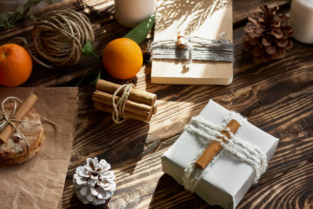 istock Chic cozy craft gift boxes on wooden background. Natural aestetic. Zero waste, plastic free, trendy hand made gift package for Christmas. 1285086719
