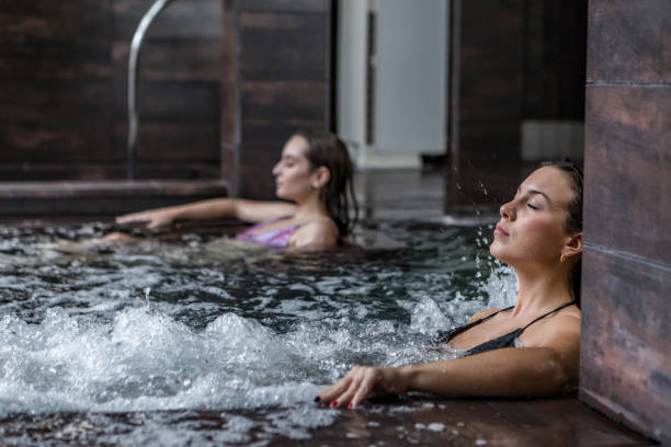 istock Serene woman in bubbling tub in spa 1285088273