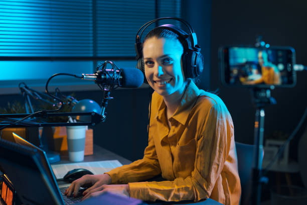 istock Smiling video blogger recording in the studio 1285090295