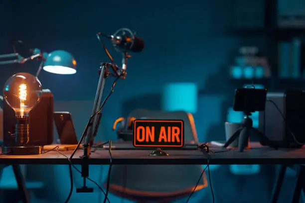 Photo of Live online radio studio with on air sign
