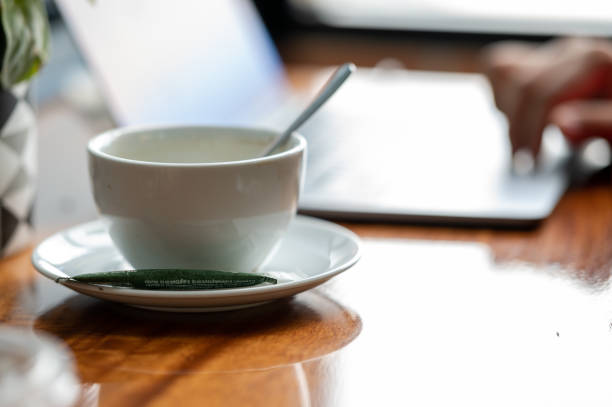 istock White coffee cup placed on the table at the coffee shop 1285093096