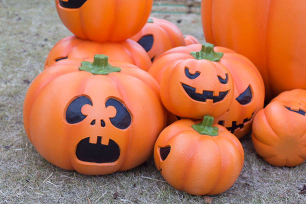 istock Halloween scary pumpkin with a smile in autumn park. 1285093273