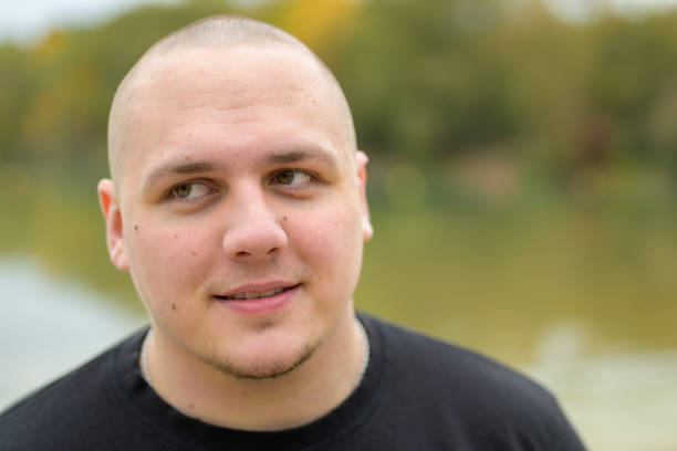 istock Close up head shot of a thoughtful young man 1285096601