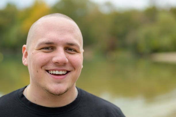 istock Happy young man laughing at the camera 1285097240