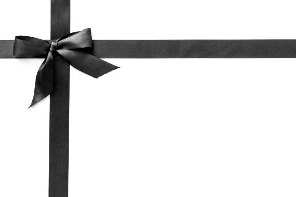 istock Black ribbon with bow isolated on white. Top view, copy space 1285099343