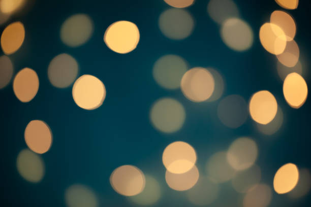 istock Abstract Blue Christmas lights bokeh background. Selective focus. 1285099553