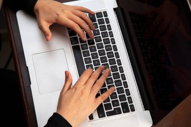 istock Fingers working on keyboard on laptop 1285099561
