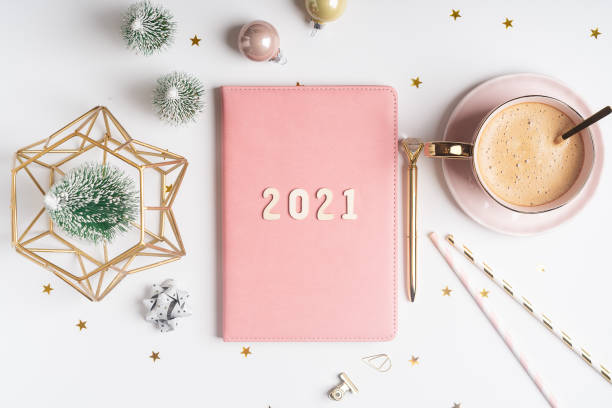 istock Flat lay of Christmas notepad with 2021 letters text 1285102409