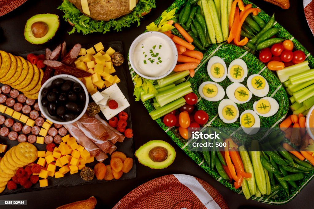Table full of delicious snack for football game watching party. Table full of delicious snack for football game watching party for fans. Match - Sport Stock Photo