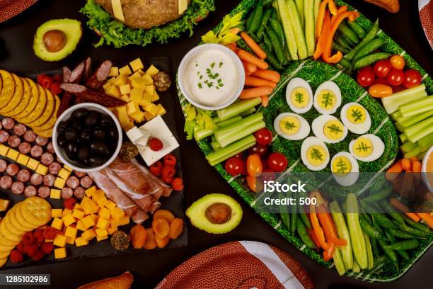 Table Full Of Delicious Snack For Football Game Watching Party Stock Photo - Download Image Now