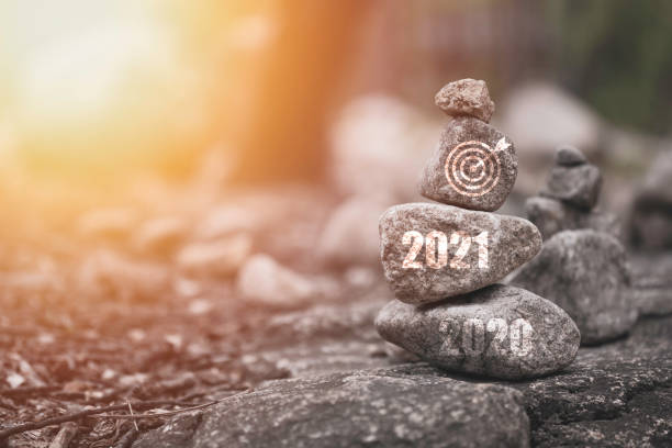 countdown and welcome for 2021 new year concept , 2021 and target board print screen on stone stacking with copy space.