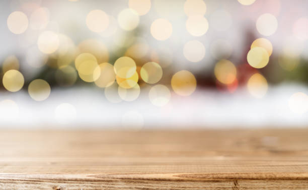 istock Christmas background or greeting card with space for text. Glowing snow bokeh. Winter holidays on white background 1285103104
