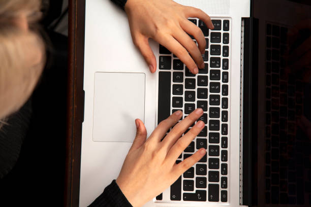 istock Fingers working on keyboard on laptop 1285105161
