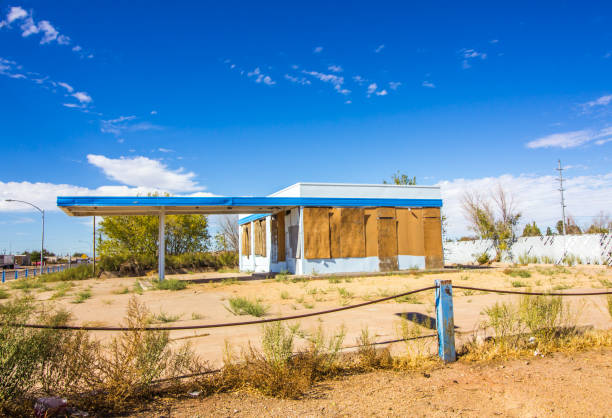 istock Abandoned Gas Station Building With Boarded Up Windows 1285105311