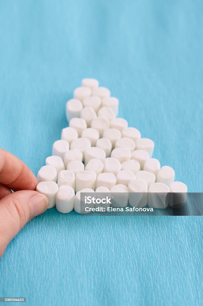 Interesting tree. White marshmallows. Blue background SONY DSC 30-34 Years Stock Photo Interesting tree. White marshmallows. Blue background SONY DSC 30-34 Years Stock Photo