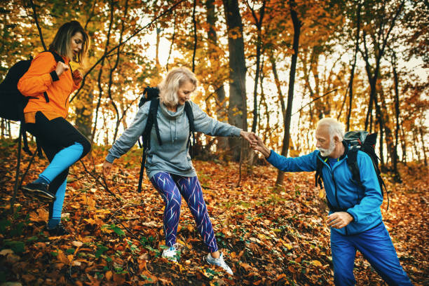 istock Group of mature hiking through a forest. 1285107118