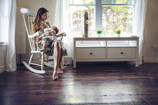 istock Mom breastfeeding her child 1285107943