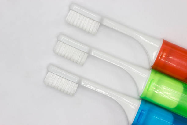 istock Colourful travel toothbrushes on a white background 1285108129