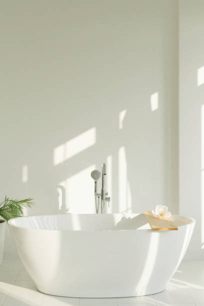 istock Minimalistic white bathroom in white room 1285108476