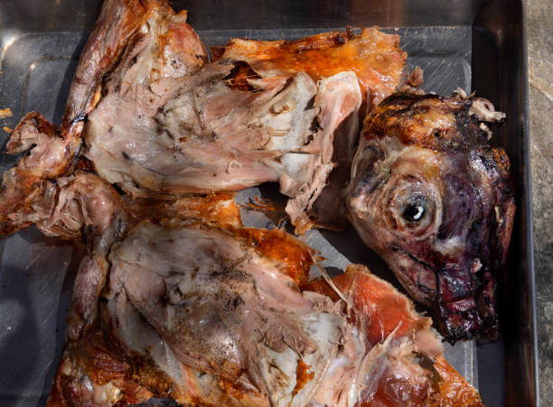 istock Easter lamb with its head chopped into large chunks, baked on a spit in a village in Greece 1285115083