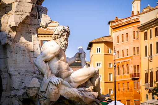 View of city main square Piazza del Plebiscito with Basilica Reale Pontificia San Francesco da Paola church and the bronze statue of king Ferdinand I. Naples, Italy