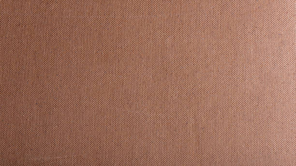 istock Texture of brown cardboard or thick pressed cardboard as a background. 1285116526