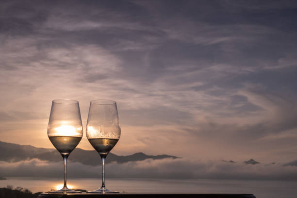 istock Two glasses of white Wine on a panoramic rooftop 1285118765