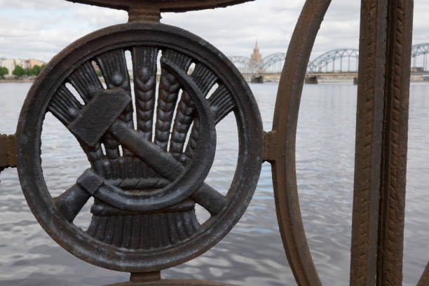 istock Soviet sickle and hammer ornament on Railway Bridge over Daugava River in Riga, Latvia 1285120327