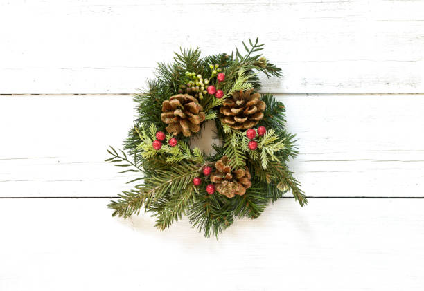 istock Christmas wreath on an old wood background 1285121101