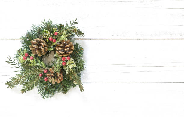 istock Christmas wreath on an old wood background 1285121200
