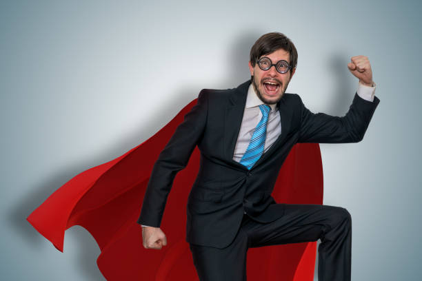 istock Funny nerdy businessman in superhero suit. 1285121273