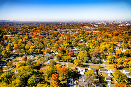 A suburban neighborhood located just outside of Nashville Tennessee, the city's skyline visible in the distance.