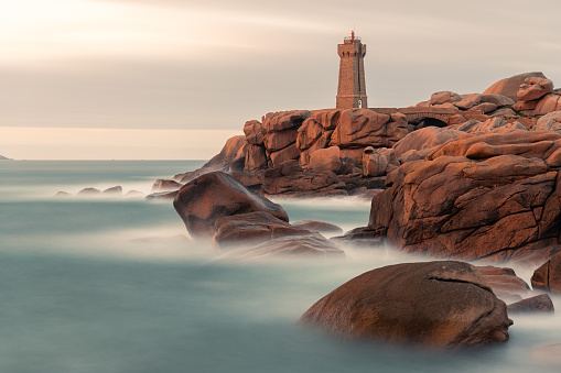 The pink granite lighthouse of Ploumanac'h (Brittany, France) stands in the middle of the chaotic rock formations formed by the erosion of cooled magma then shaped by the rain, salty sea spray and wind. Its name comes from the Breton 