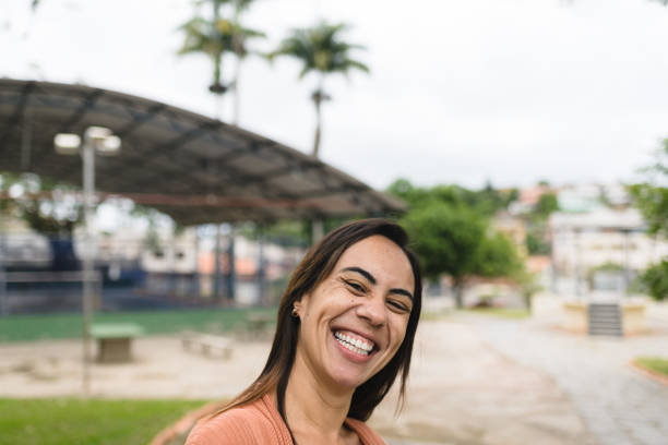 istock Smiling woman in public park 1285124189