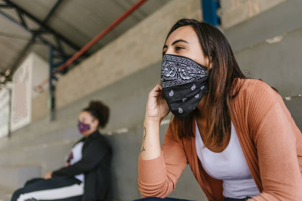 istock Women wearing protective mask at stadium 1285124195