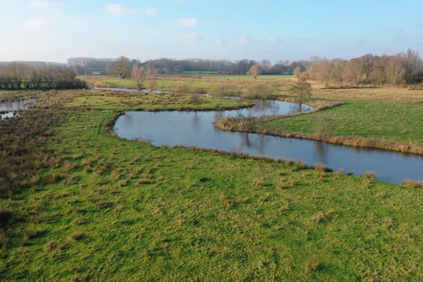istock A small river that is meandering to the lush green meadows 1285124209