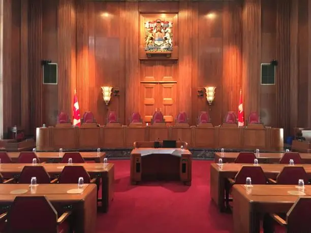 The chamber of the Supreme Court of Canada with the Canadian Coat of Arms
