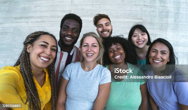Group Multiracial Friends Having Fun Outdoor Happy Mixed Race People Taking Selfie Together Youth Millennial Generation And Multi Ethnic Teenagers Lifestyle Concept Stock Photo - Download Image Now